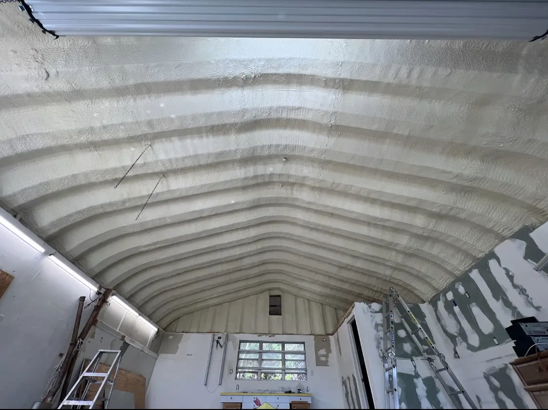 Spray polyurethane foam applied to the underside of a metal roof deck in Poway